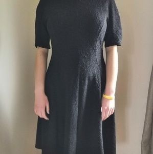 Black embossed dress